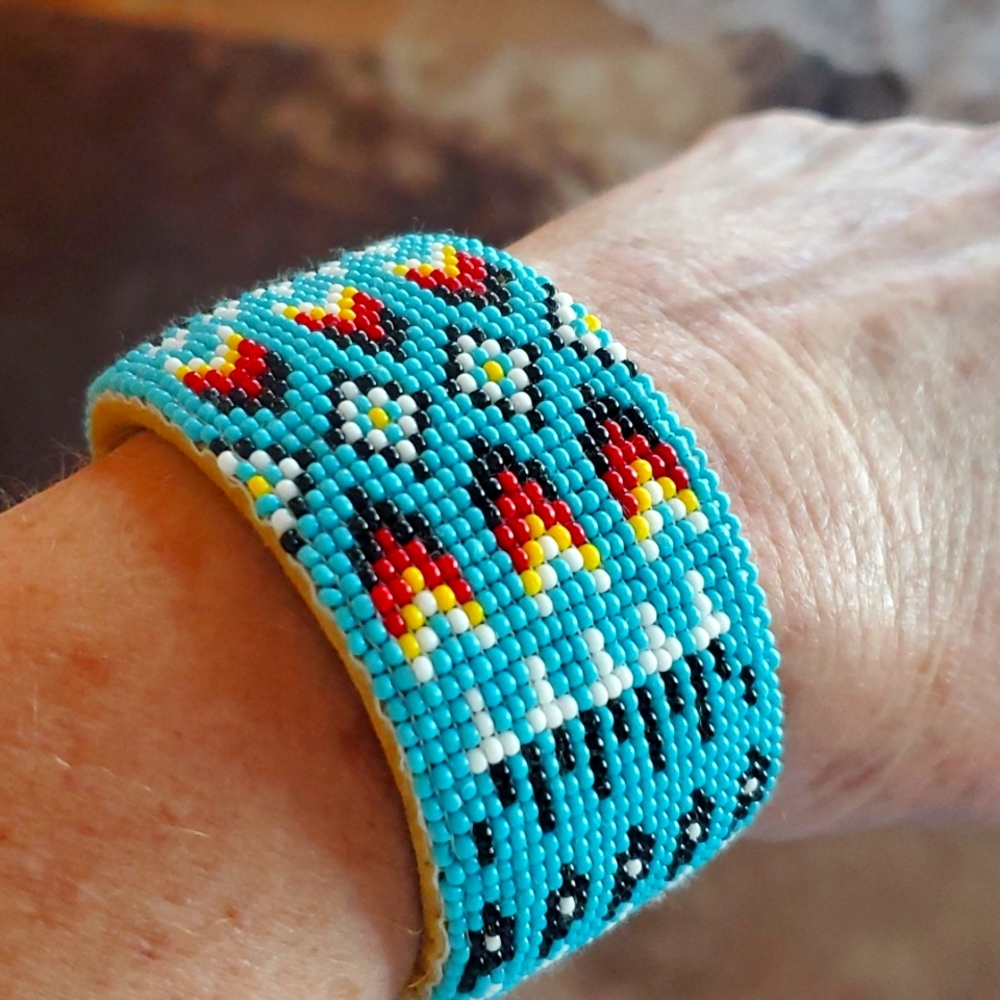 Blue, red, yellow, white, black Beaded indian print adjustable bracelet.